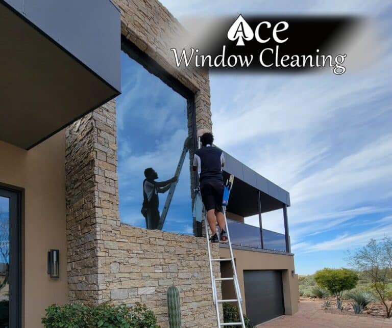 Image of a residential window getting cleaned.