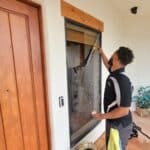 Image of a window Stain Removal Compay cleaning a window